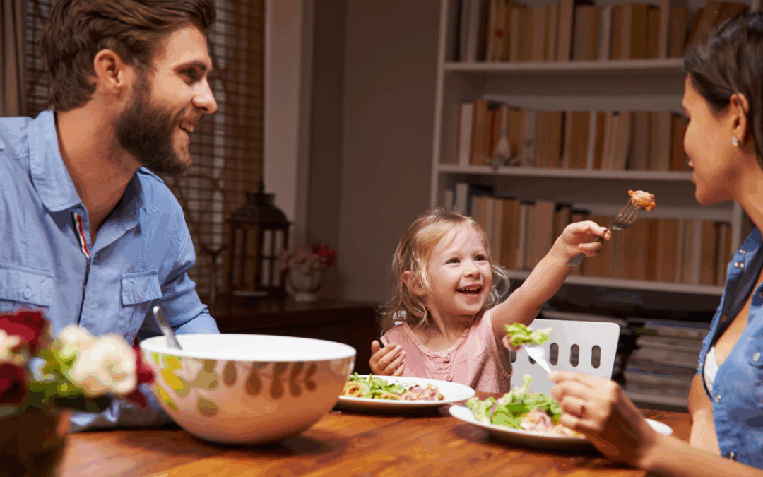 family sitting down and eating dinner
