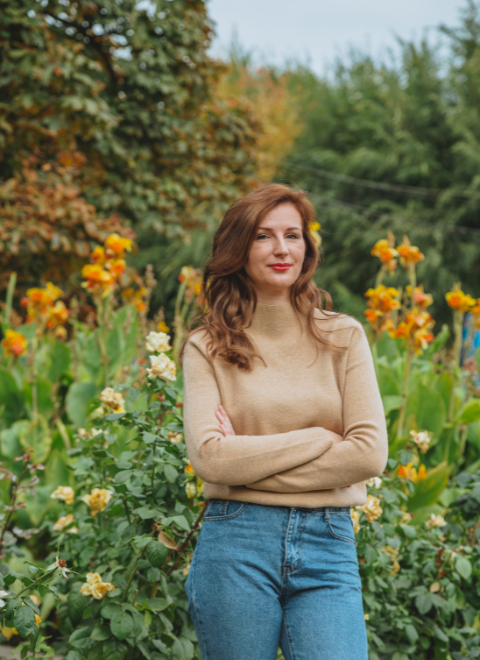 woman standing in flower field 